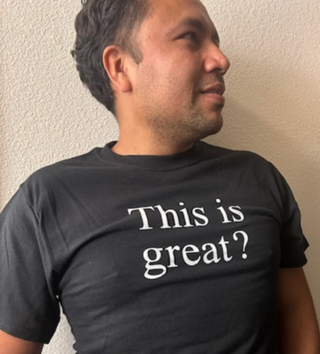 Unisex graphic tees and hoodies featuring the text 'This is great?' on a black shirt.